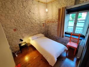 A bed or beds in a room at Ca Borines