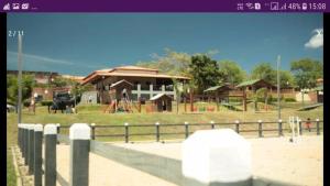 a park with a playground with a building at Flat Monte Castelo em Gravata PE in Gravatá