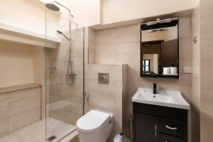 Kúpeľňa v ubytovaní To Rodi Apartments + 11 fotografií