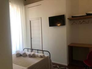 Uma TV ou centro de entretenimento em Ursino's Luxury