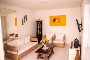 Uma área de estar em Apartamento com varanda Gourmet na praia da enseada