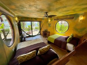 
a bedroom with a bed and a window at Sueños Tulum in Tulum
