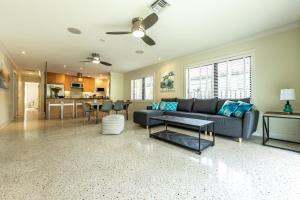 a living room with a couch and a table at LoveLee Villa: Luxury Hollywood 4 Bedroom w/Pool in Hollywood