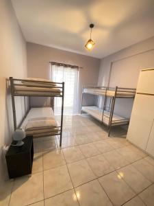 A bed or beds in a room at Nafplio Boutique Apartment