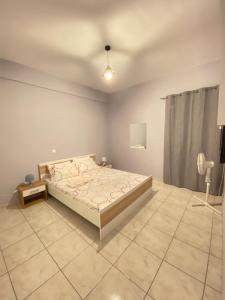 A bed or beds in a room at Nafplio Boutique Apartment