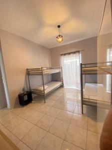 A bed or beds in a room at Nafplio Boutique Apartment