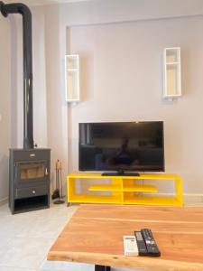 A television and/or entertainment centre at Nafplio Boutique Apartment