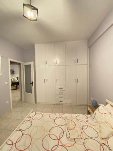 A bed or beds in a room at Nafplio Boutique Apartment