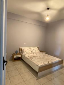 A bed or beds in a room at Nafplio Boutique Apartment