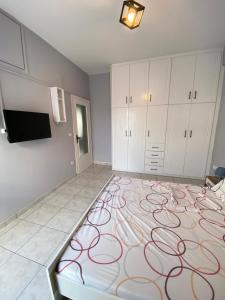A bed or beds in a room at Nafplio Boutique Apartment