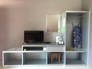 TV i/ili multimedijalni sistem u objektu Harmony Guesthouse Sdn Bhd