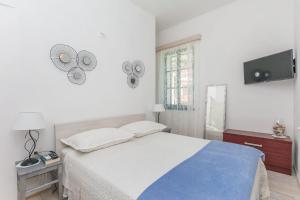 Postel nebo postele na pokoji v ubytování Apartments Porto Duce