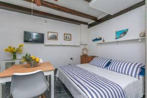 Postel nebo postele na pokoji v ubytování Apartments Porto Duce