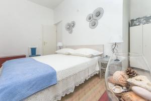 Postel nebo postele na pokoji v ubytování Apartments Porto Duce