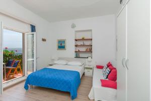 Postel nebo postele na pokoji v ubytování Apartments Porto Duce