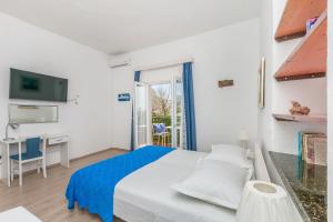 Postel nebo postele na pokoji v ubytování Apartments Porto Duce