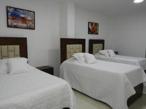 Postel nebo postele na pokoji v ubytování Solaris Hotel