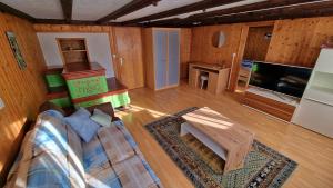 a living room with a couch and a coffee table at Chez Rosalie in La Roche