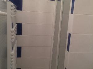 a shower in a bathroom with white tiles at Studio Corrençon-en-Vercors, 1 pièce, 4 personnes - FR-1-515-79 in Corrençon-en-Vercors