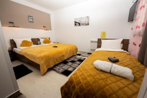 Letto o letti in una camera di Complex Turistic Dávid