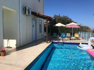 a swimming pool in the backyard of a house at Breathtaking sea and Mountain views with Private pool, Peace full relaxing Villa with WiFi near Shops and Restaurants in Chania