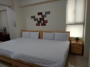 Postel nebo postele na pokoji v ubytování Ark stay方舟文旅山嵐新館溜滑梯商務民宿