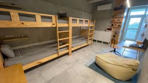 A bed or beds in a room at Shan Shan Come Later