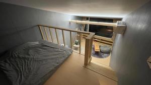 A bed or beds in a room at Shan Shan Come Later