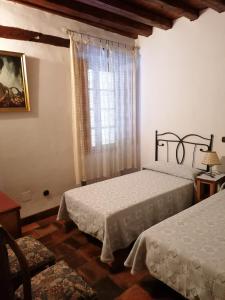 Кровать или кровати в номере Casa rural Callejón del Palacio