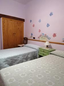 Cama o camas de una habitación en Casa rural Callejón del Palacio