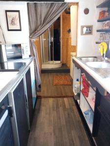 a kitchen with a sink and a counter top at Edouard Boat in Brussels