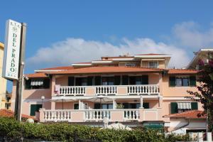 a building with a sign in front of it at Del Prado in Riva Ligure