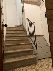 a stairway in a building with a stair railing at Casa Roveglia in Brescia
