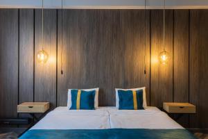 Voodi või voodid majutusasutuse Tulip Residence & Spa Hotel toas