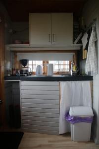 a kitchen with a sink and a counter top at Skógarkot Cottage in Selfoss