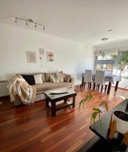 a living room with a couch and a table at Quinta Luna in San Carlos de Bariloche
