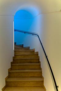 a staircase with a blue light on the top at Hotel Bellavista in Anacapri