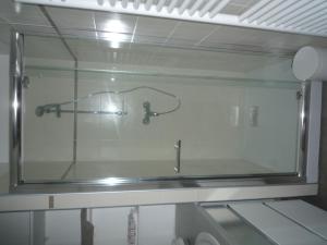 a glass shower in a bathroom with a sink at Appartement Hypercentre Quimper in Quimper +41 photos