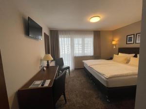 Ein Bett oder Betten in einem Zimmer der Unterkunft Hotel Regina