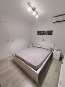 A bed or beds in a room at Albir cosy apartment