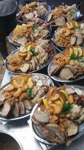 a bunch of plates of food on a table at apartma fortuna kmečki hram in Idrija