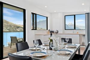 A restaurant or other place to eat at Lakeside Bliss - Queenstown Holiday Home