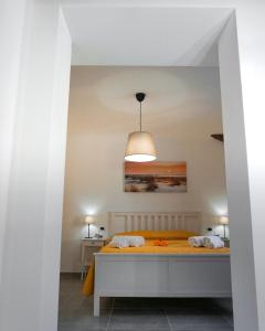 A bed or beds in a room at La Terrazza Azzurra