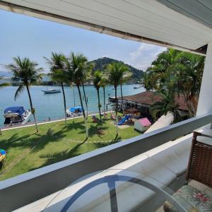 a view of the ocean from a house balcony at Condominio Aquarius 1 in Angra dos Reis