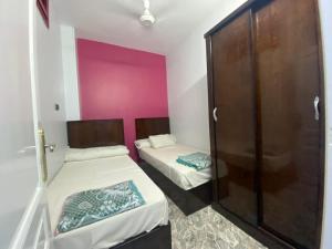 A bed or beds in a room at ALRahman Building