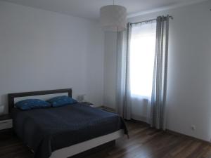 Postel nebo postele na pokoji v ubytování Appartment Ipsum