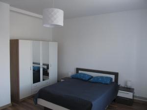Postel nebo postele na pokoji v ubytování Appartment Ipsum