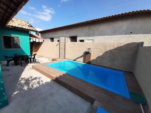a swimming pool in the backyard of a house at Vivamar2 in Cabo Frio