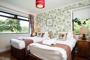 Katil atau katil-katil dalam bilik di Kinloch Lodge