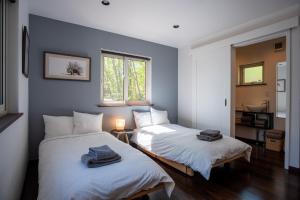 Voodi või voodid majutusasutuse Forest Hideaway toas
